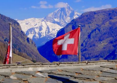 swiss flag and mountains