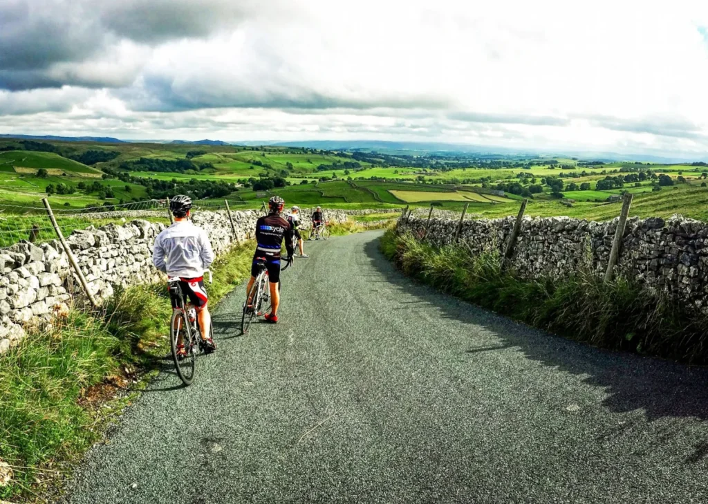 cyclists taking in the view of the Lake District